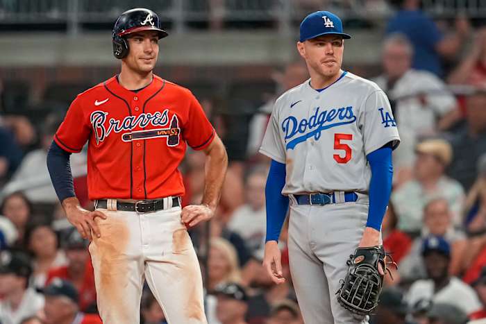 Jun 24, 2022; Cumberland, Georgia, USA; Atlanta Braves first baseman Matt Olson (28) on base next to Los Angeles Dodgers first baseman Freddie Freeman (5) during the ninth inning at Truist Park.